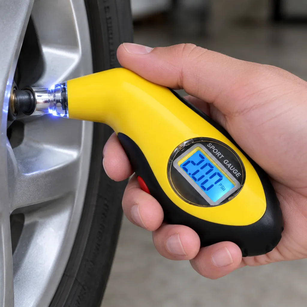 Hand pressing a digital tire pressure gauge onto a car tire valve to read the pressure