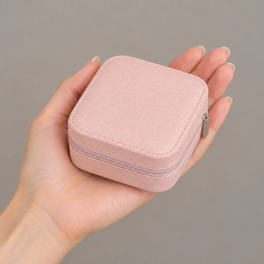 Mini jewelry box held in one hand to show its small size