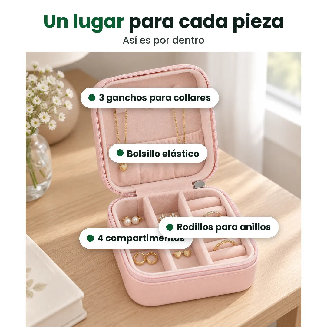 Interior del joyero de viaje: 3 ganchos para collares, bolsillo elástico, 4 compartimentos y rodillos