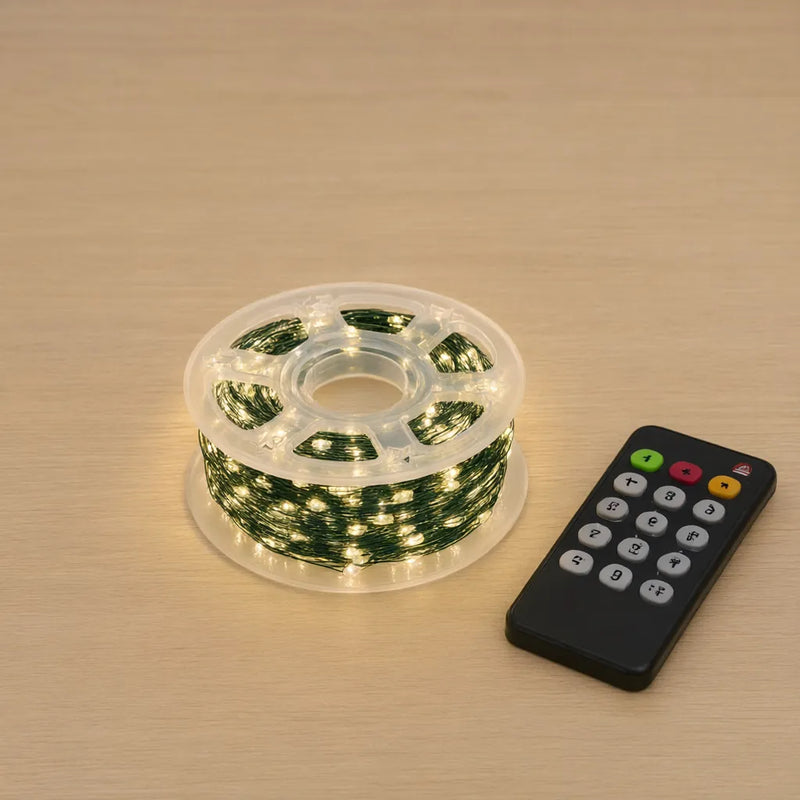 Green wire LED string lights on a clear reel with a remote control
