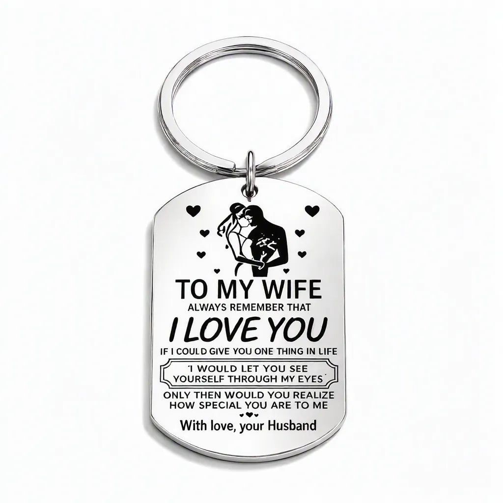 Silver engraved stainless steel dog tag keychain on a white background