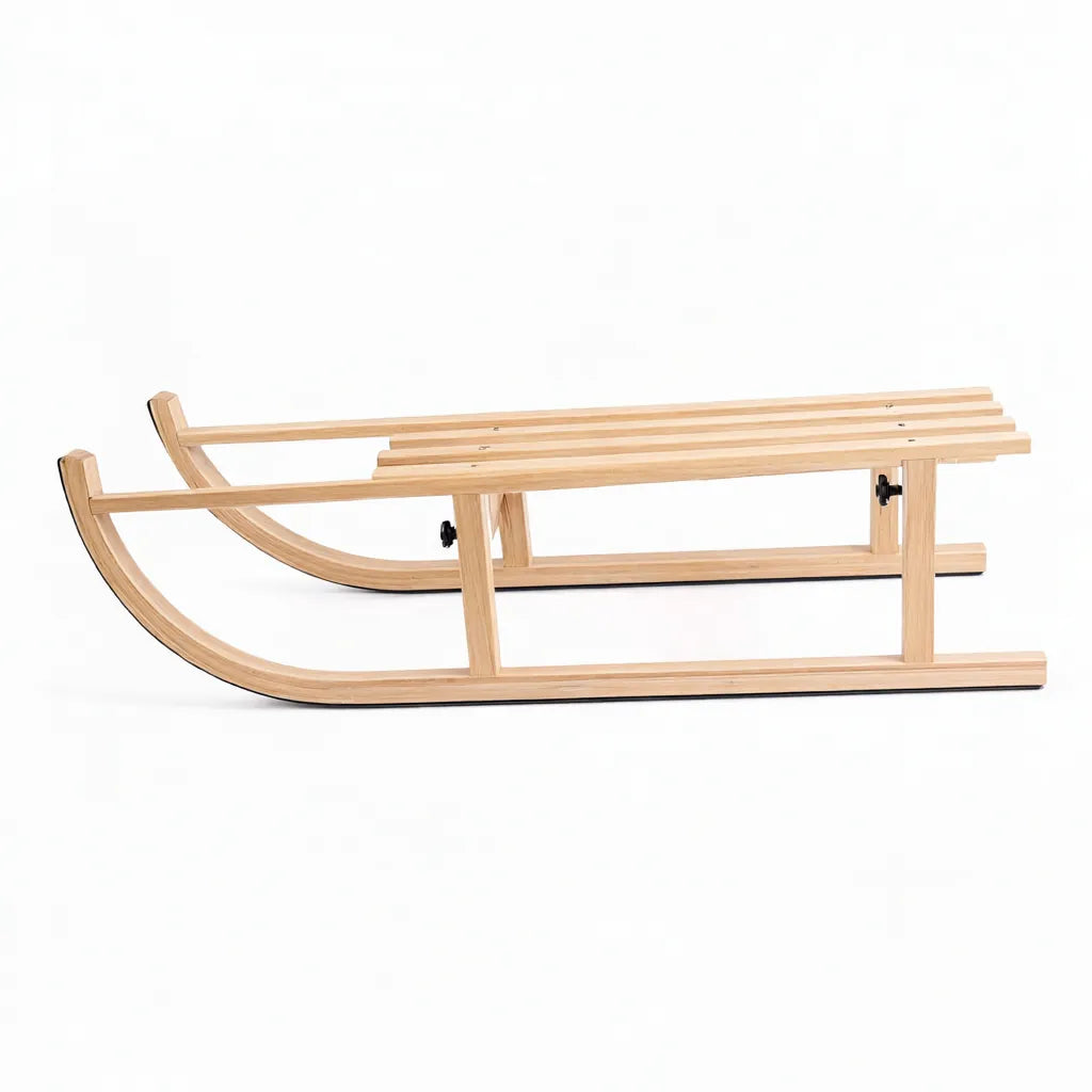 Foldable beech wooden sled with curved runners on a white background
