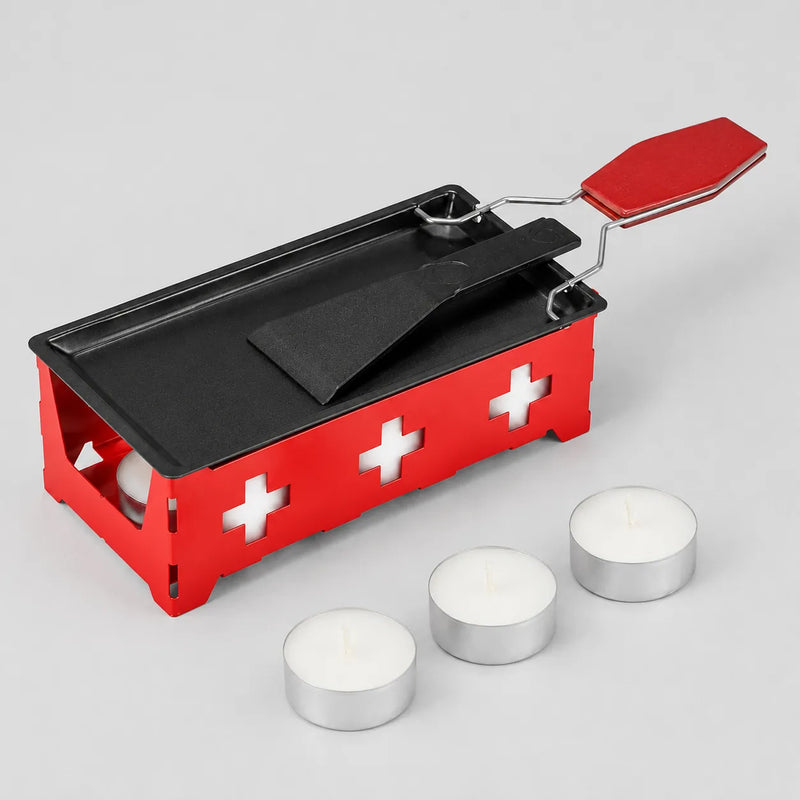 Mini-Raclette-Set mit rotem Ständer, Antihaft-Pfännchen, Schaber und drei Teelichtern
