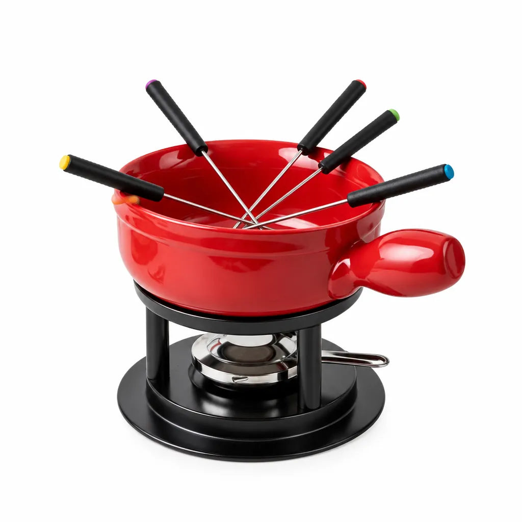 Red ceramic fondue set with black stand, burner and six forks on white background
