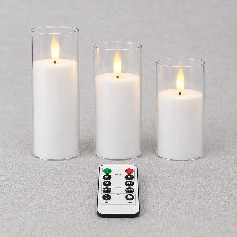 Three flameless LED pillar candles in clear shells and the remote control