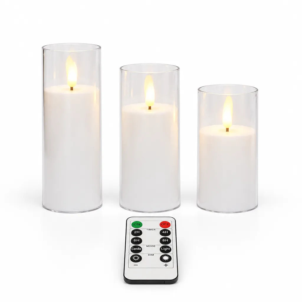 Three white flameless candles in clear shells with the remote control
