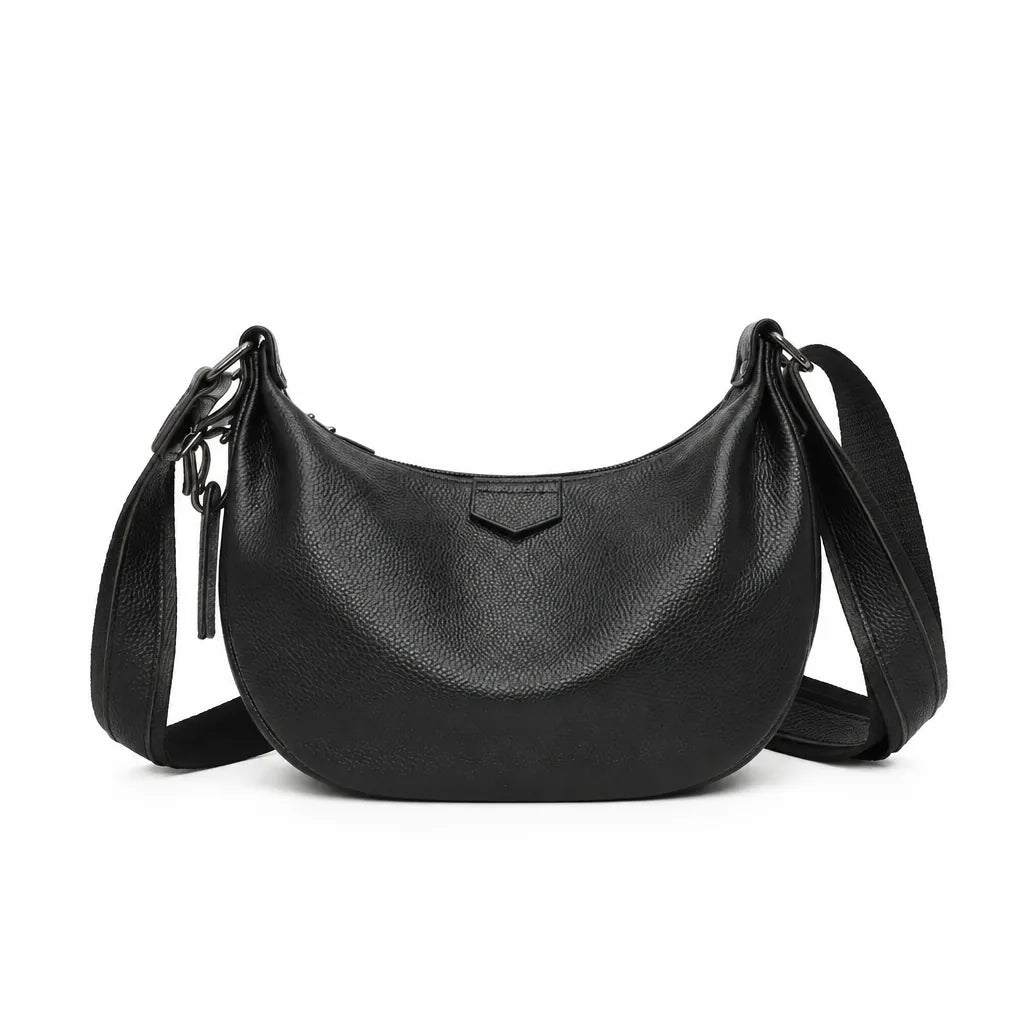 Black crescent leather shoulder bag for women with wide strap on a white background