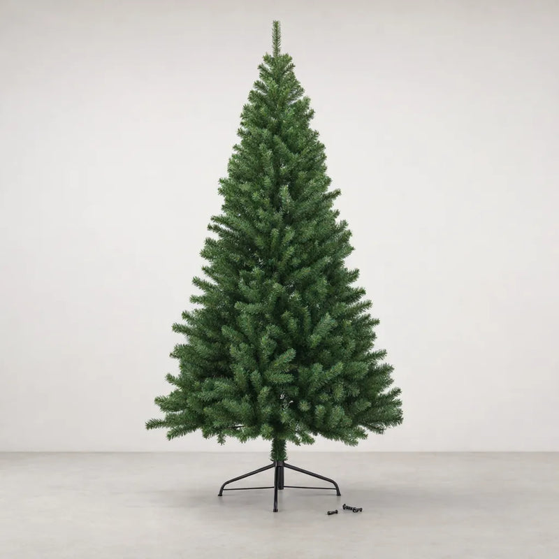 Green artificial Christmas tree on its black folding metal stand