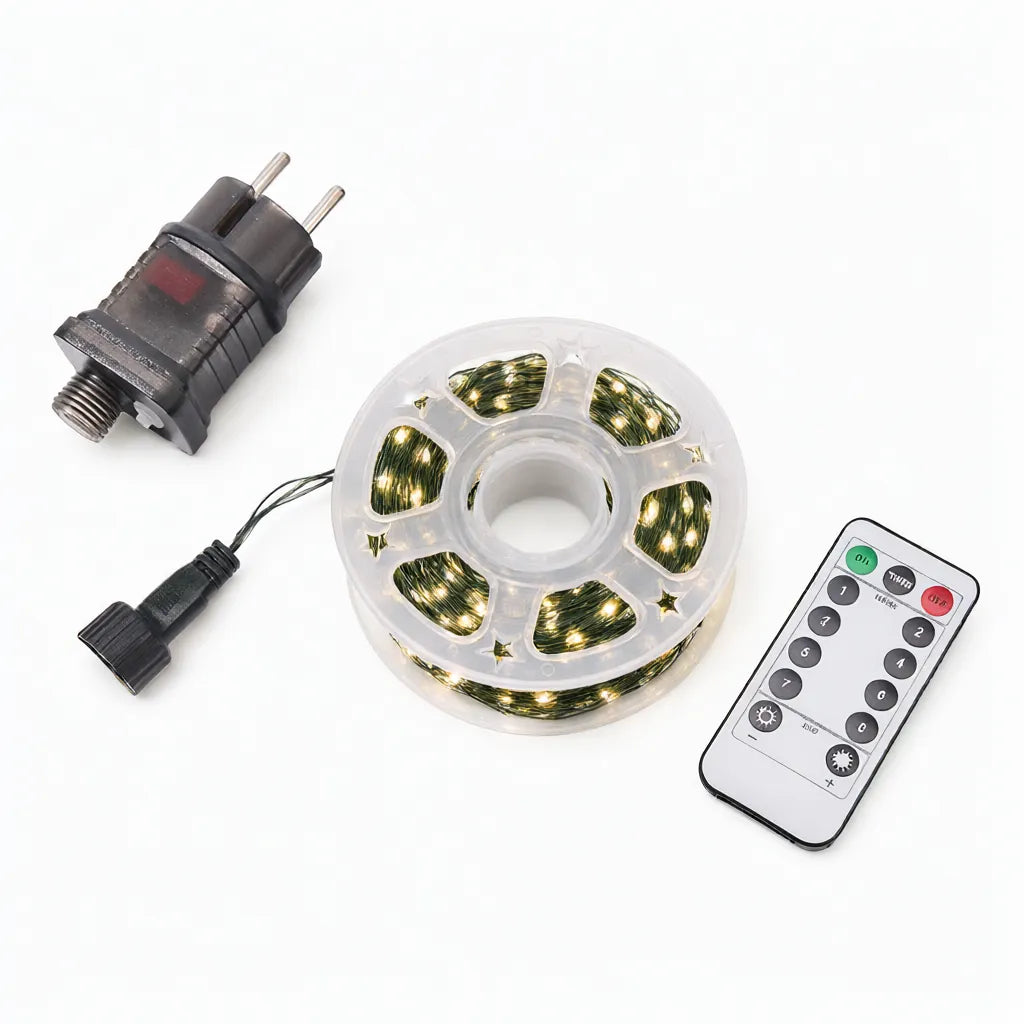 Warm white LED string lights on a clear reel with EU power adapter and remote control on white
