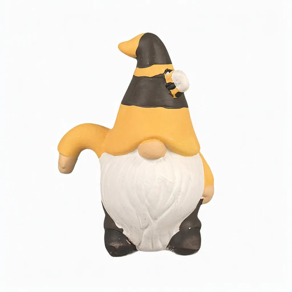 Small ceramic garden gnome statue with a black and yellow bee hat and white beard