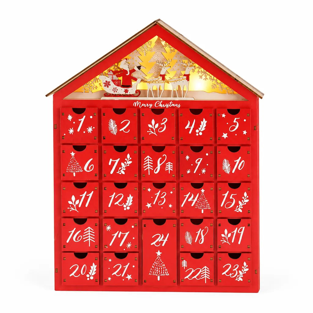 Red wooden advent calendar house with 24 numbered drawers and a lit Santa sleigh roof scene