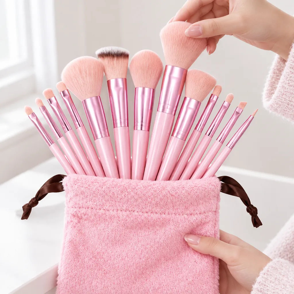 Woman lifting a powder brush from a pink makeup brush set standing in its fluffy drawstring pouch