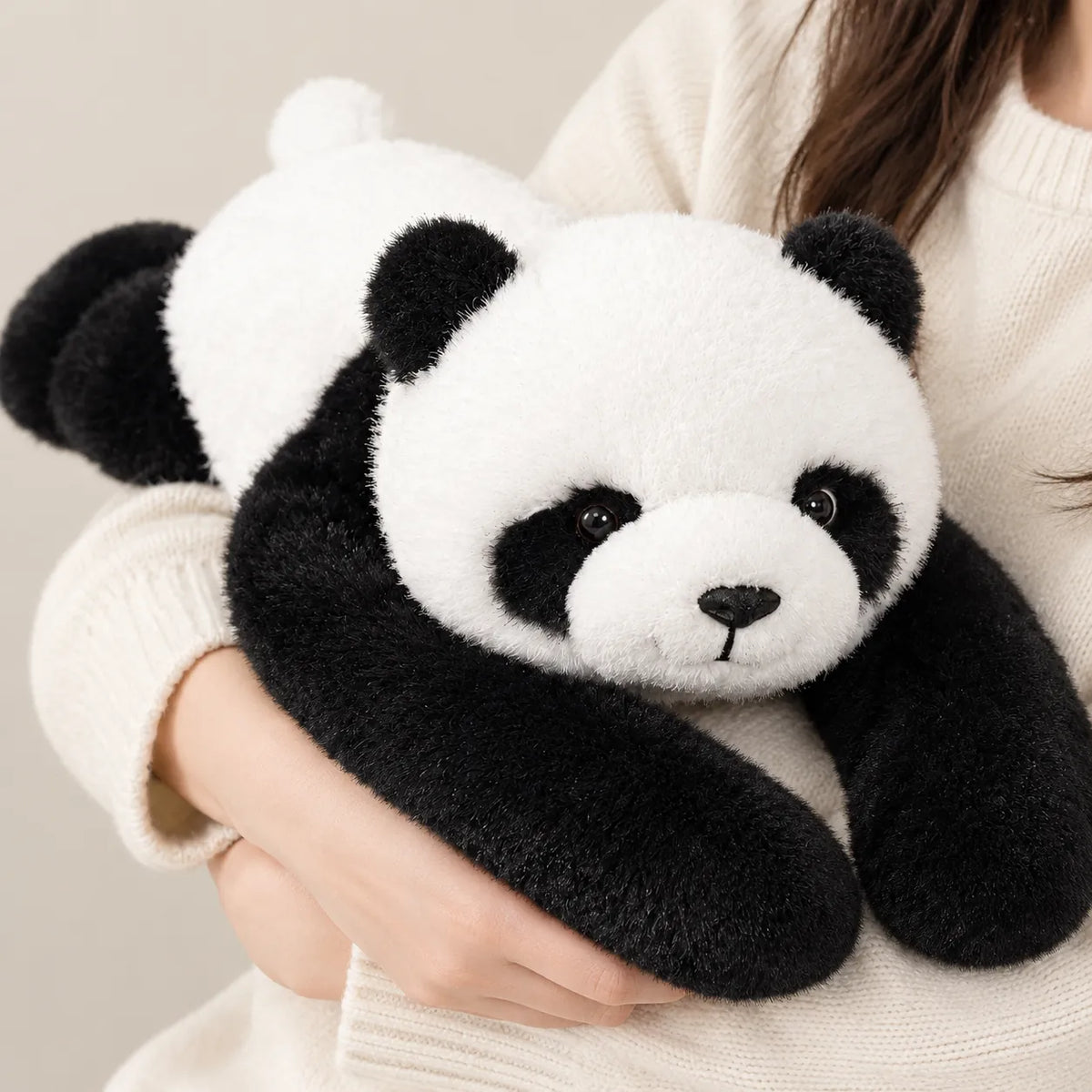 Person hugging a weighted stuffed animal panda with long heavy arms