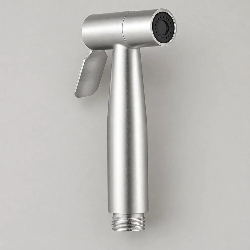 Brushed stainless steel handheld bidet sprayer head on a grey surface