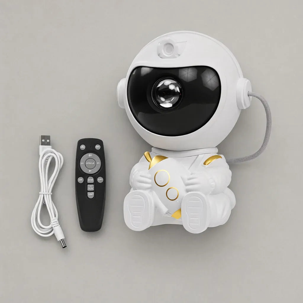 Astronaut star projector night light with remote control and USB cable laid out flat
