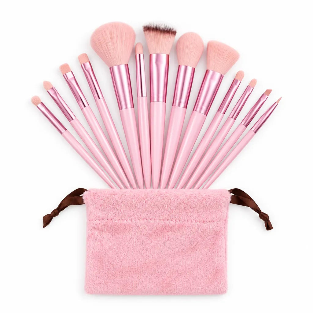 Pink makeup brushes fanned out above a fluffy pink drawstring pouch: 5 face brushes and 8 eye brushes