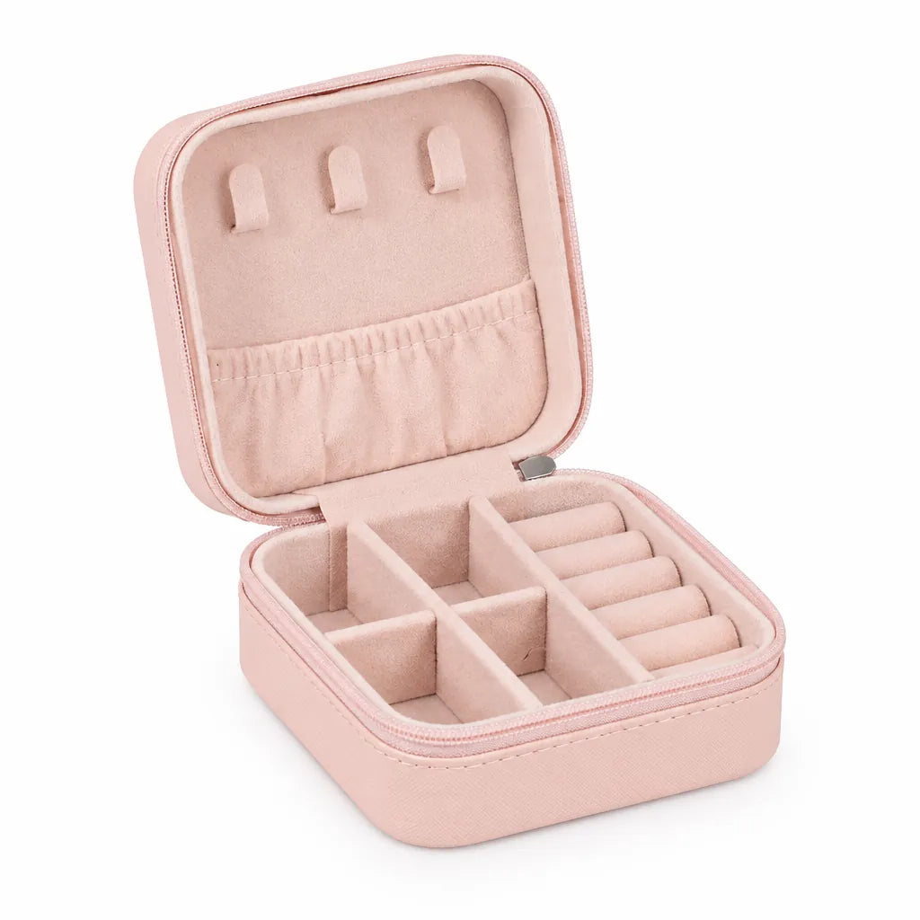 Pink travel jewelry case open and empty, with necklace tabs, elastic pocket, compartments and ring rolls