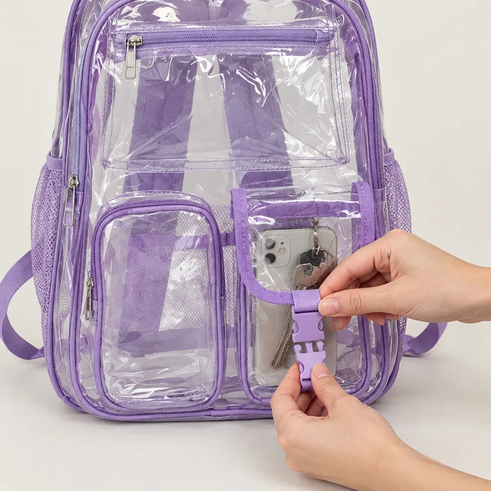 Hands closing the buckle pocket of a clear backpack holding a phone and keys