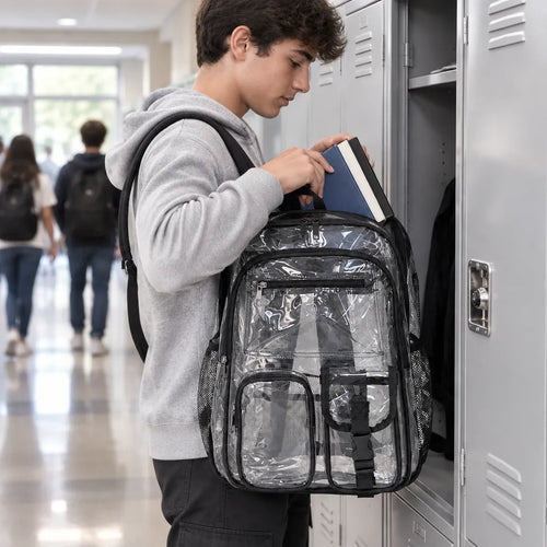 Teen putting a book into a clear school backpack at a locker