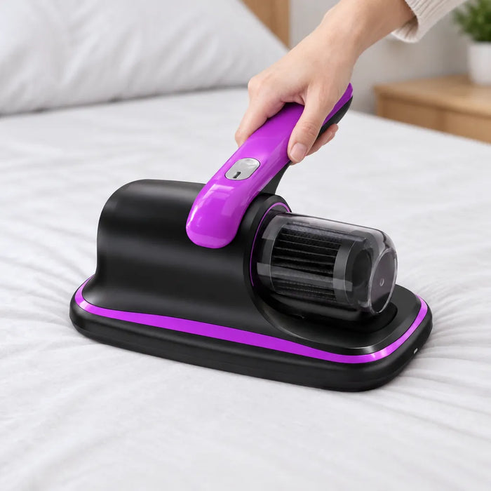 Hand gliding a cordless bed vacuum across a white mattress