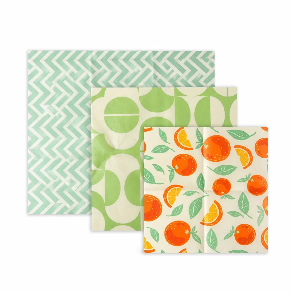 Set of 3 reusable beeswax food wraps in small, medium and large on white