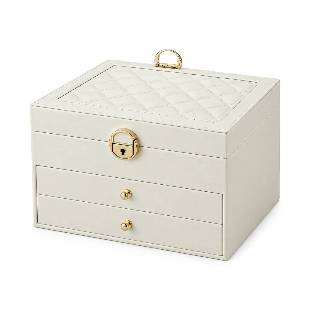 Cream-white 3-tier jewelry box with two drawers, quilted lid and gold lock on white