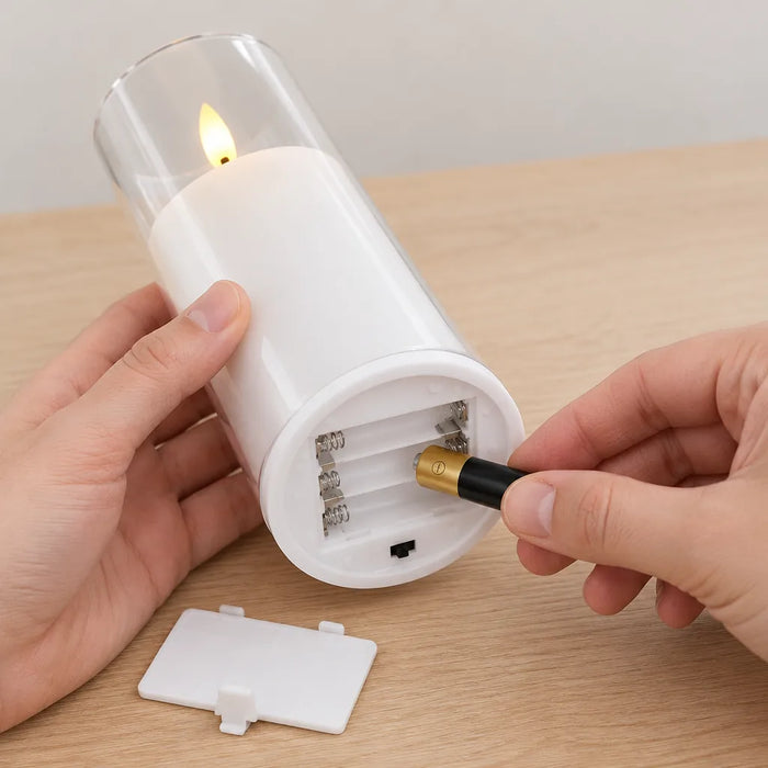 Hands putting AAA batteries into the base of a flameless LED pillar candle