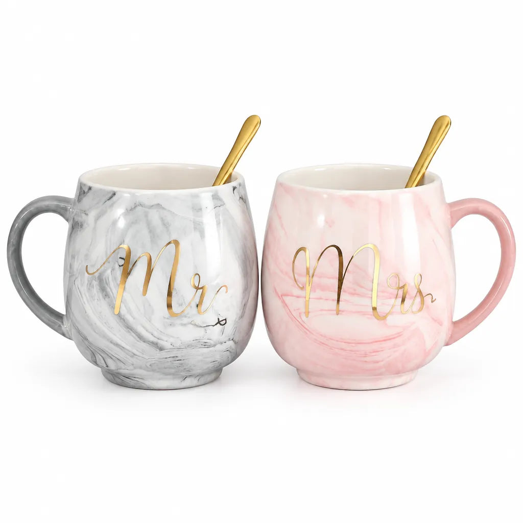 Mr and Mrs mugs: grey and pink marble ceramic mug set with gold spoons on white