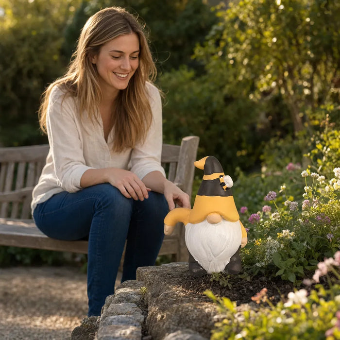 Smiling woman on a garden bench looking at a ceramic garden gnome on a flower bed edge