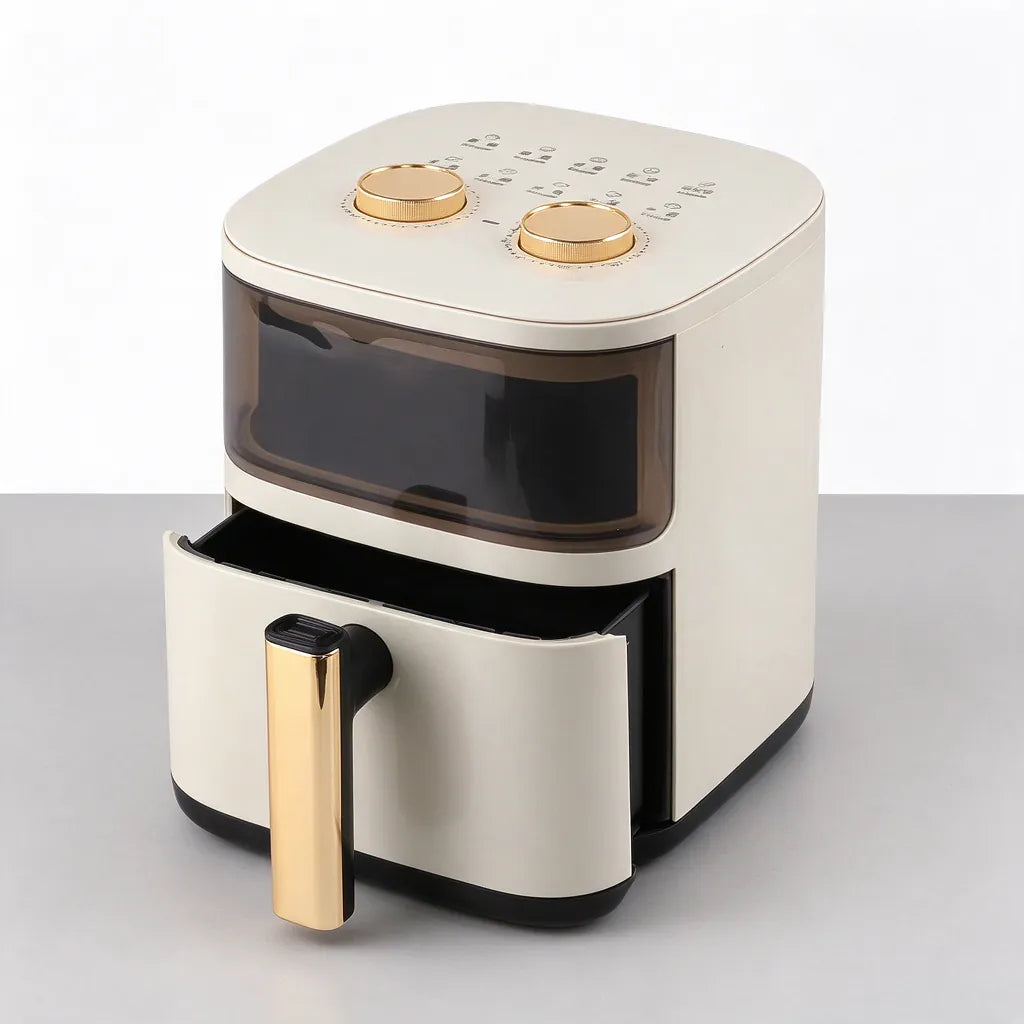 Cream white 6L air fryer with its drawer basket pulled halfway out on a grey surface