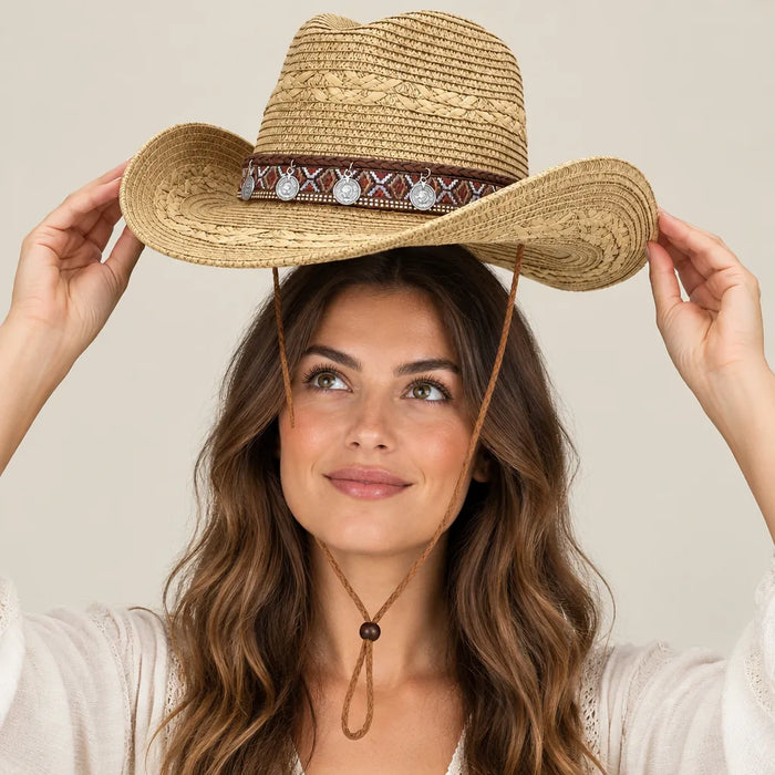 Woman putting on a khaki western straw hat with both hands